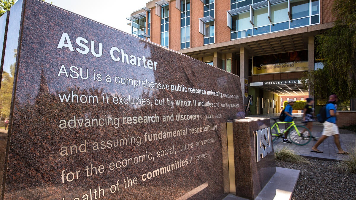 A stone marker engraved with the ASU charter. 