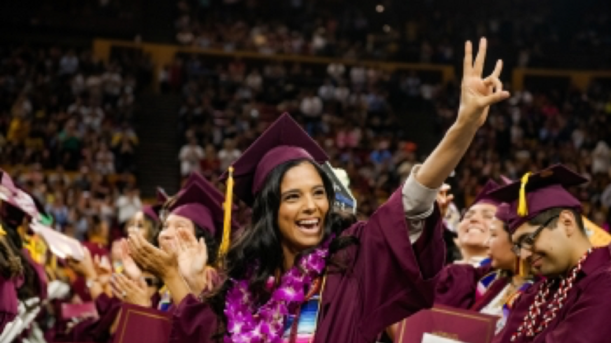 ASU spring 2020 graduate making pitchfork gesture