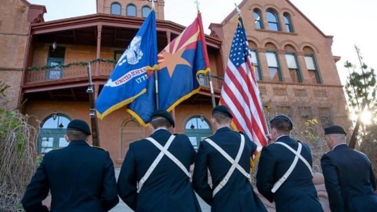 ASU honor guard enters Old Main on the Tempe campus.
