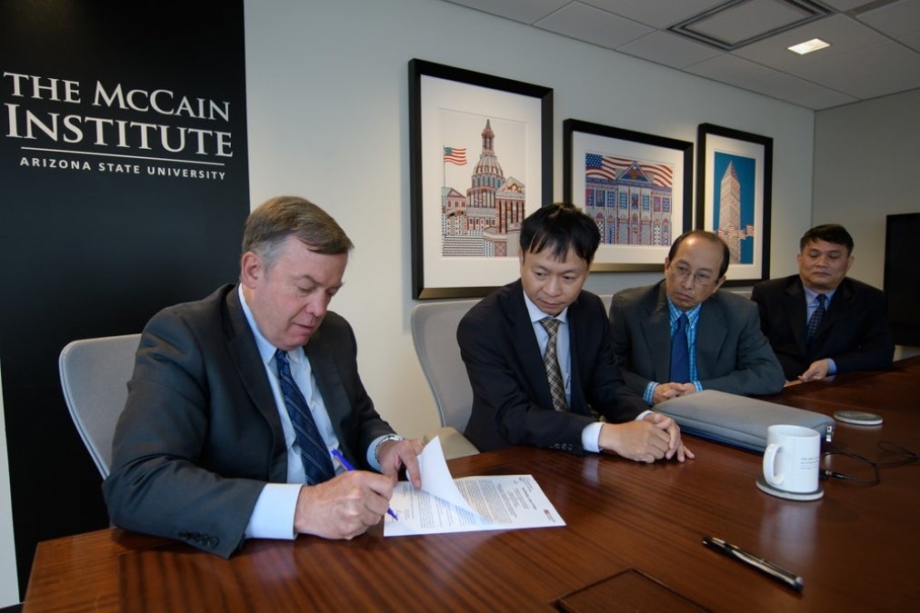 ASU President Michael Crow and representatives of the Vietnam Ministry of Science and Technology sign a letter of intent