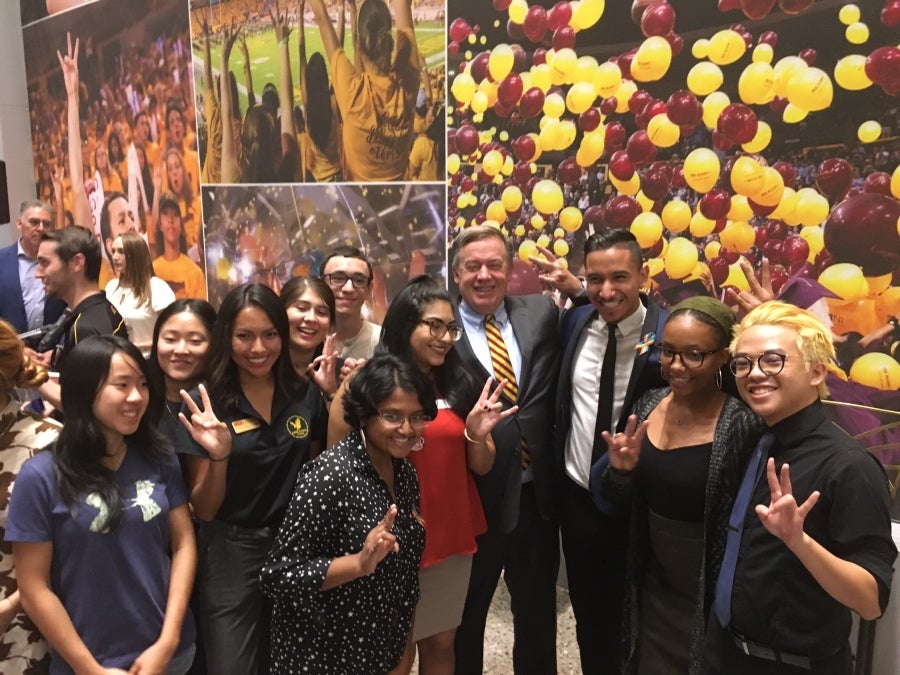ASU President Michael Crow celebrates with student leaders at the opening of the Student Pavilion